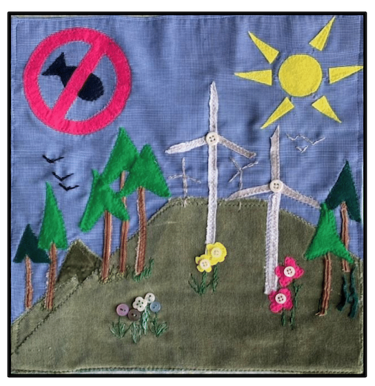 Quilt with wind mills and trees and sun